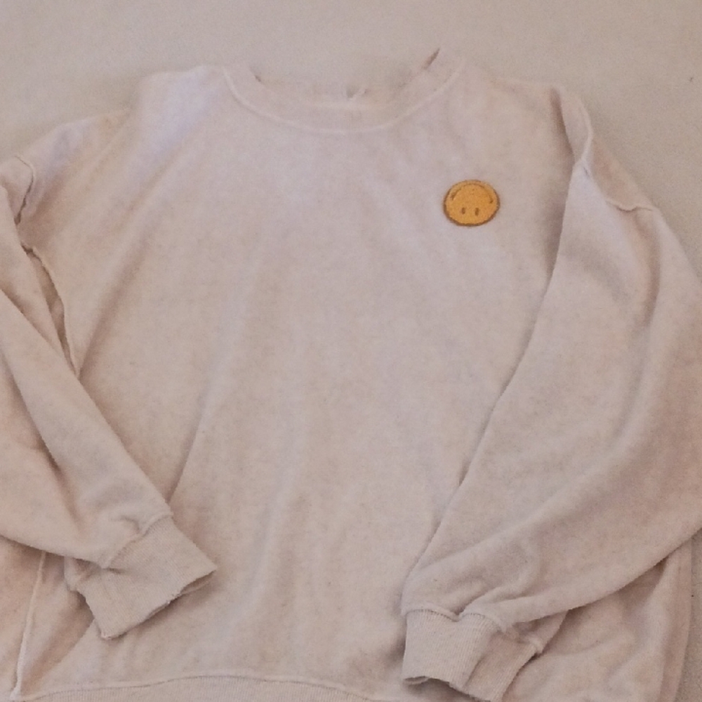 Cozy Cream Sweater with Smiley Patch